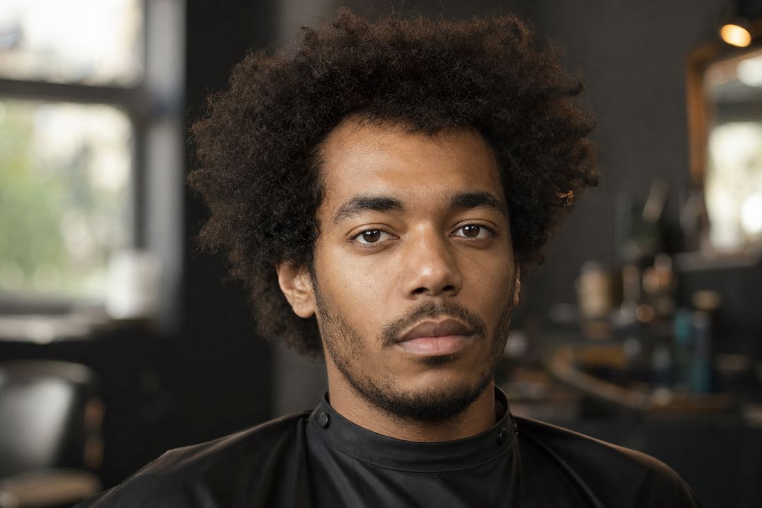 Client before his haircut, a shapeless grown-out curly top